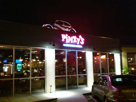 Pinkys westside grill - Painted red, white, and blue, the 1960's-era Volkswagen Beetle sits on the roof of a former car repair shop at the intersection of Morehead Street and Freedom Drive and is now home to Pinky's Westside Grill! When we arrived there was a small wait. Since we prefer to sit at the bar we walked right in (HINT HINT).